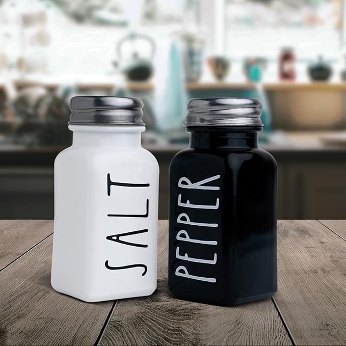 Farmhouse Salt and Pepper Shakers Set, a cute black and white premium glass shakers with stainless steel lids in a black metal holder, perfect for adding a vintage kitchen decor charm, great as a gift