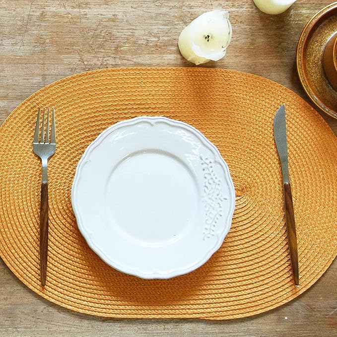 FunWheat Oval Braided Placemats Set of 4 Table Mats for Dining Tables Washable Heat Resistant Place Mats for Indoor Outdoor Use 12 x18 Inch(Oval Pumpkin Yellow, 4pcs)