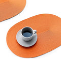 FunWheat Oval Braided Placemats Set of 8 Table Mats for Dining Tables Washable Heat Resistant Place Mats for Indoor Outdoor Use 12 x18 Inch(Oval Orange, 8pcs)